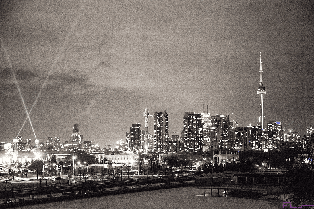 Toronto skyline and CN Tower from Ontario Place with searchlight beams