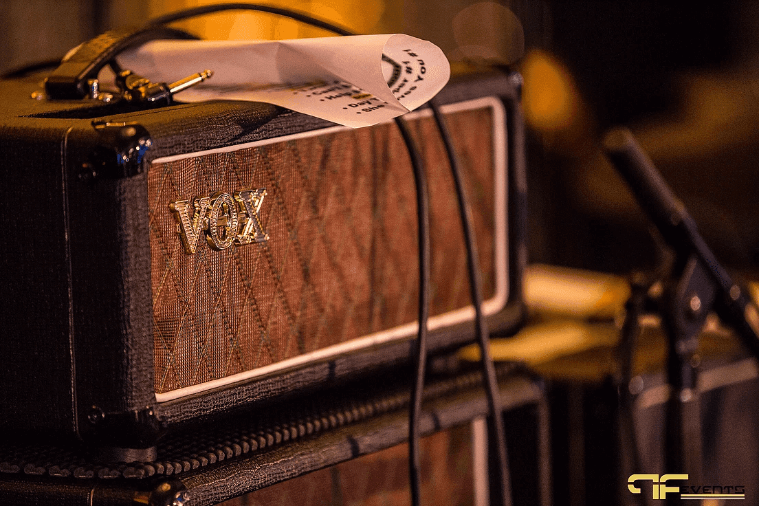 Vox guitar amp head with a set list tucked under the handle