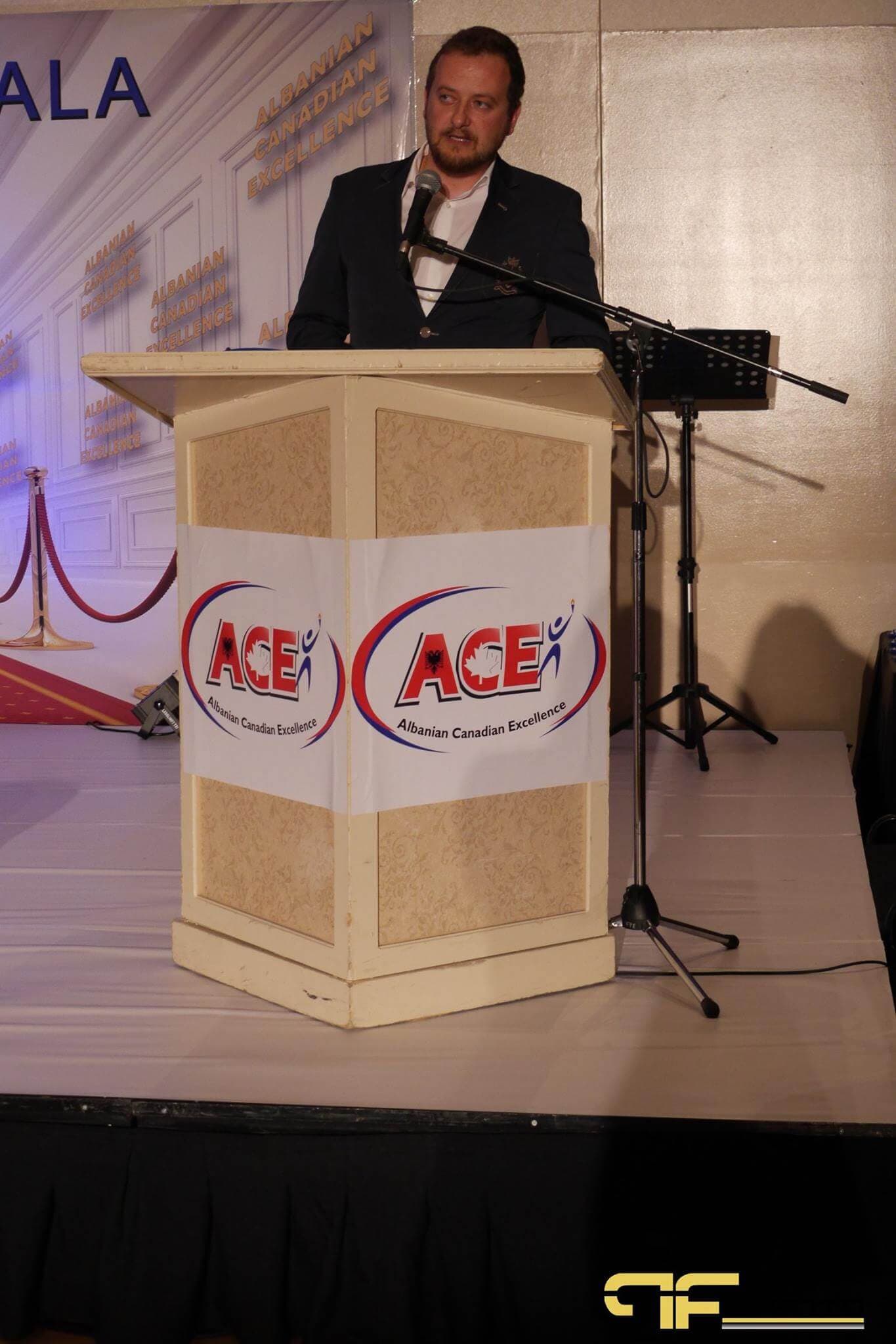 Speaker at the ACE Albanian Canadian Excellence lectern on stage