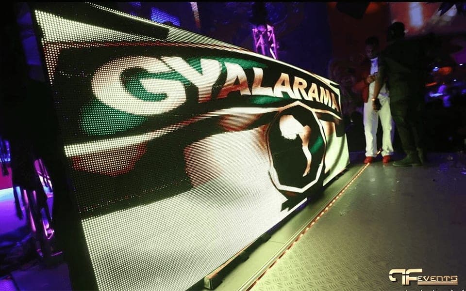 LED video wall on a stage deck displaying a Gyalarama graphic