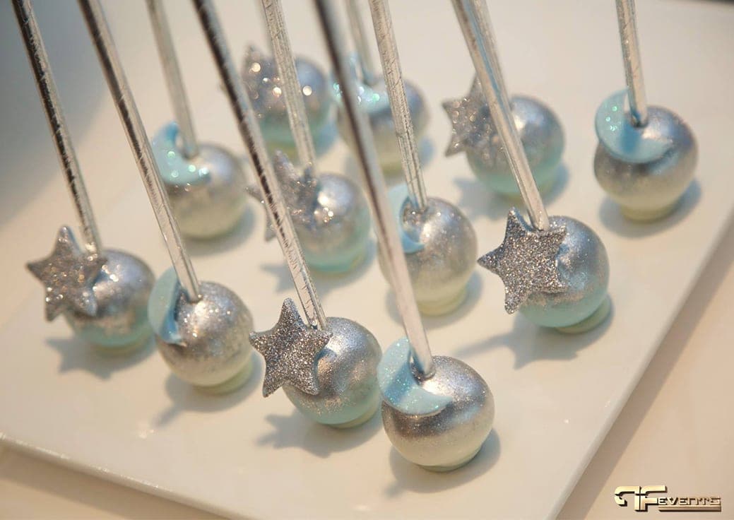 Silver and blue cake pops with glitter star accents