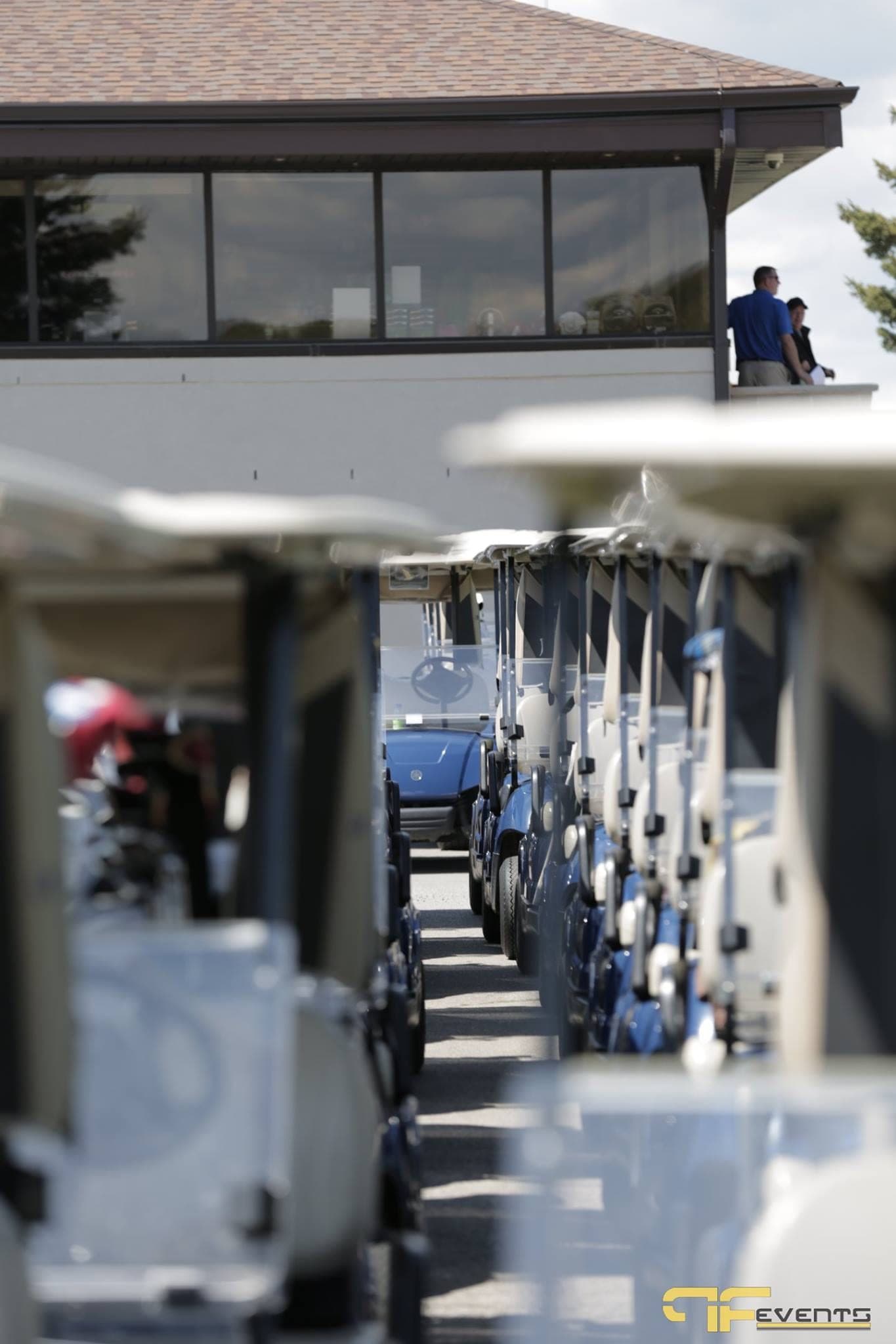Row of golf carts leading to the Nobleton Lakes clubhouse
