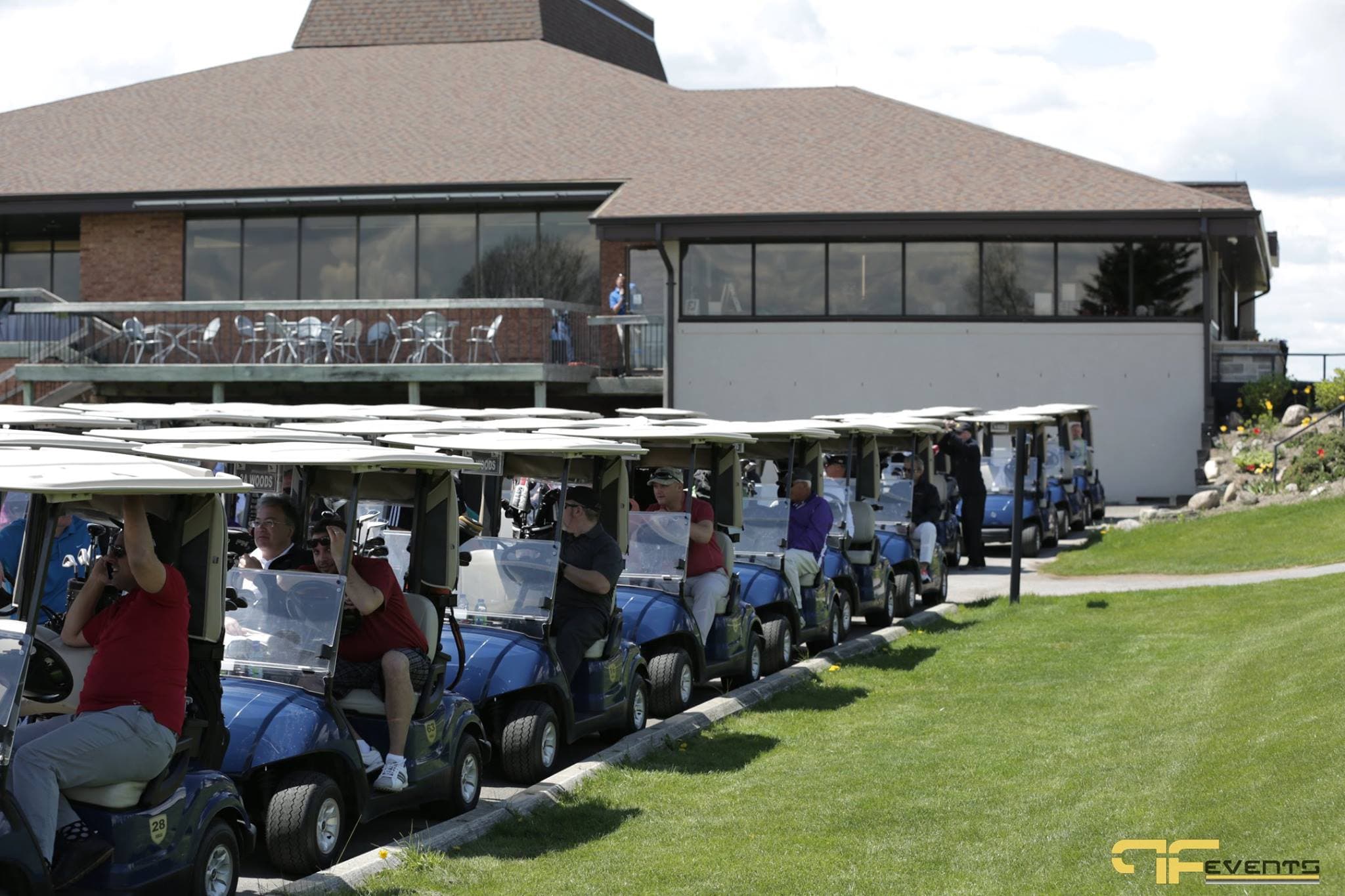 Golfers in carts queued at the Nobleton Lakes clubhouse
