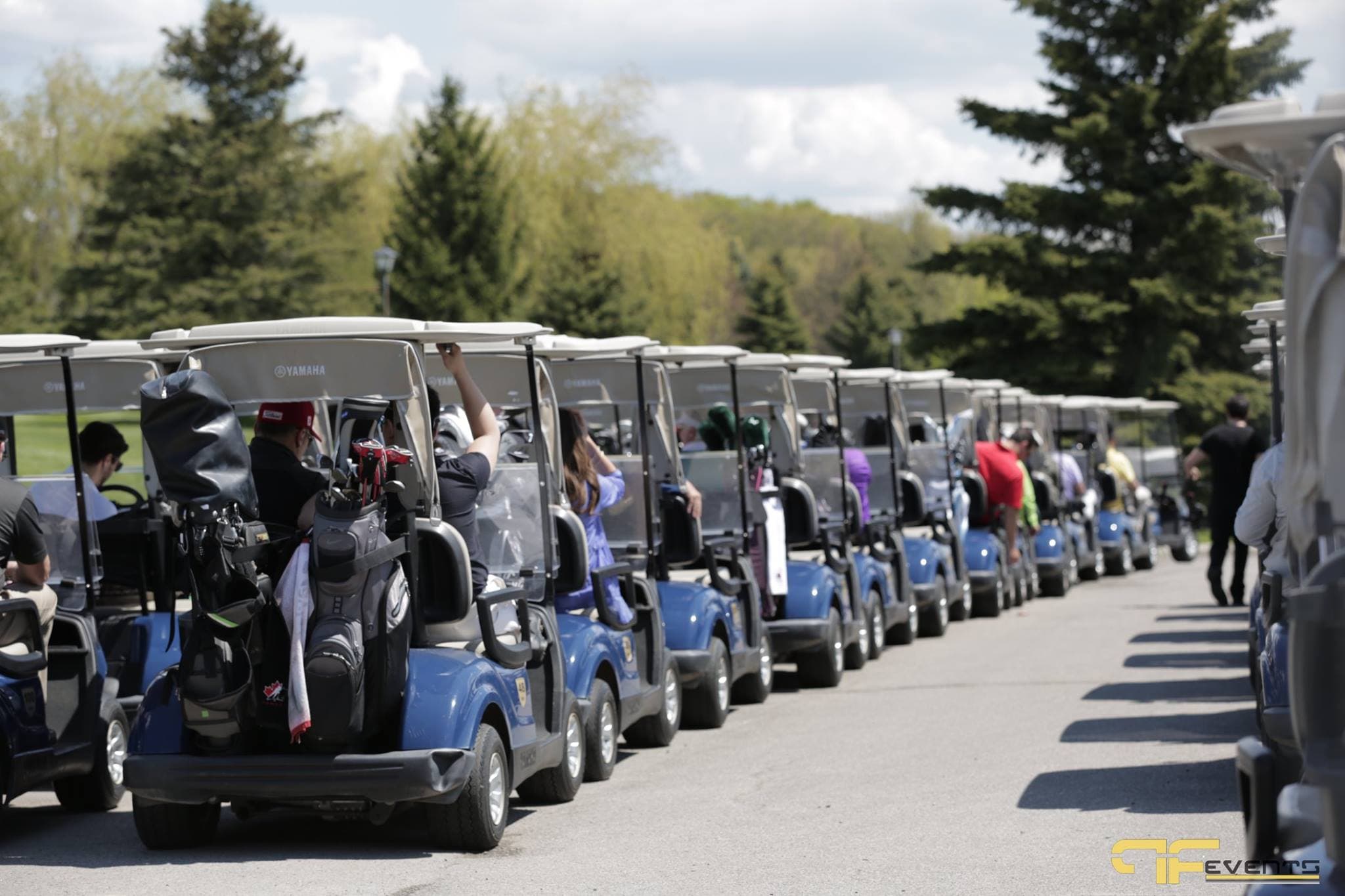 Line of loaded golf carts ready to head out on the course