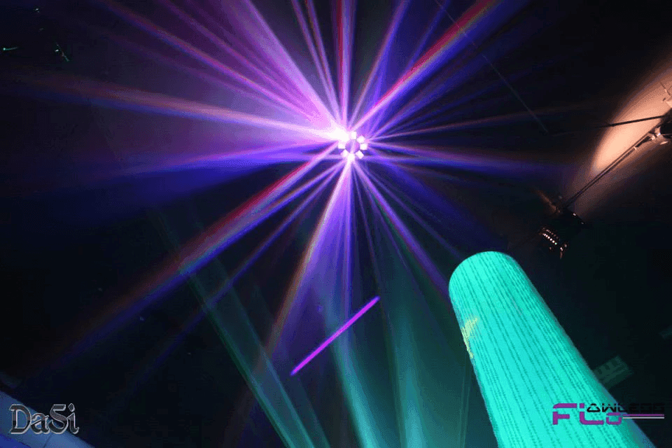 LED effect light fanning purple and pink beams above a glowing aqua column