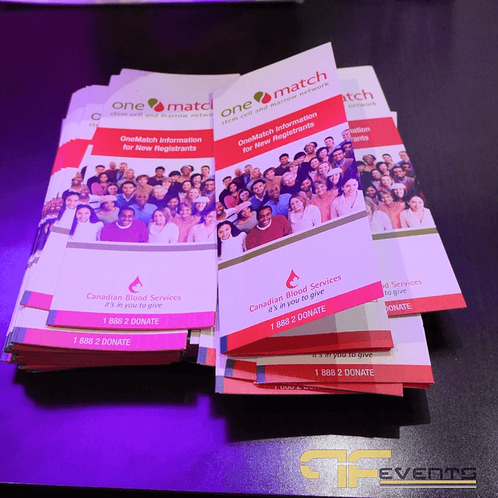 Stacks of OneMatch stem cell registry brochures from Canadian Blood Services