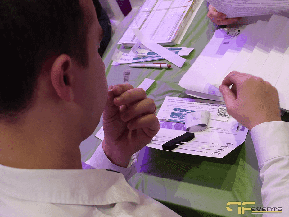 Guest swabbing his cheek to join the OneMatch stem cell registry