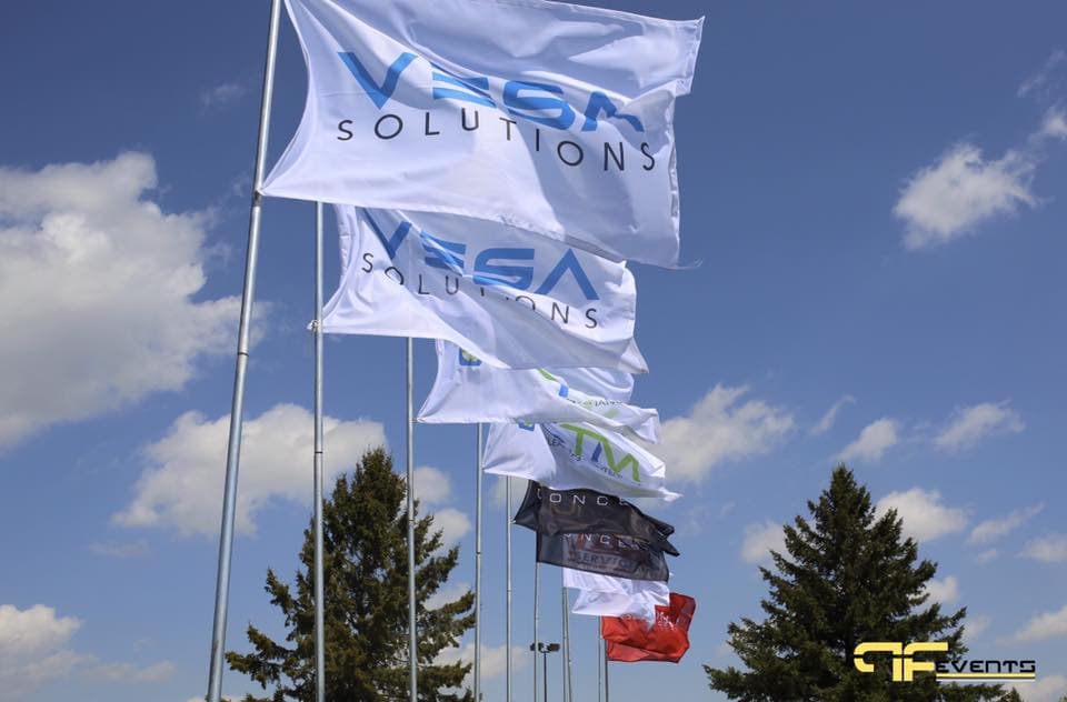 Sponsor flags flying at the Tiron Contracting golf tournament, 2017