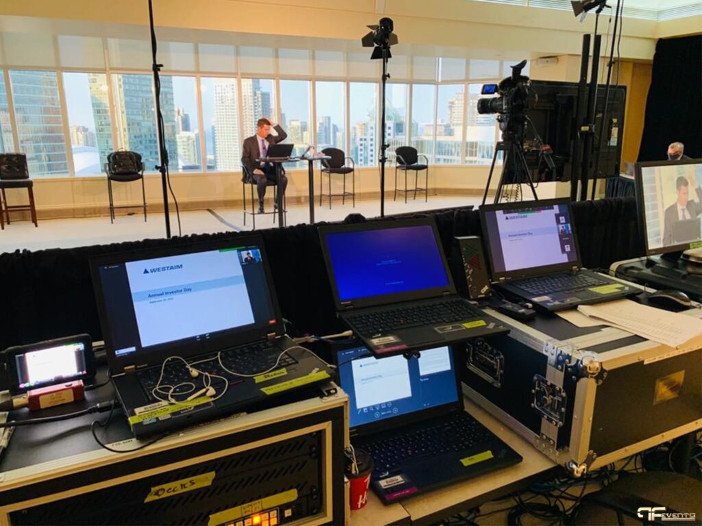 Event technician testing venue internet speed before a conference